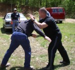 Author teaches how to use a cane to stop an attacker's grab