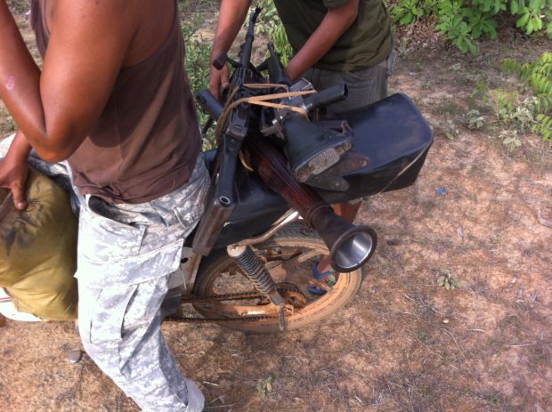 The guns arrive on the back of a scooter. What could possibly go wrong here?