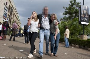 The mystery Brit with pistol tucked in his waistband helping hostages out of the mall