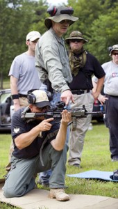 John Motil demonstrating a kneeling rifle position