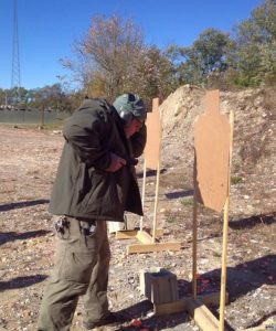 Demonstrating handgun retention shooting