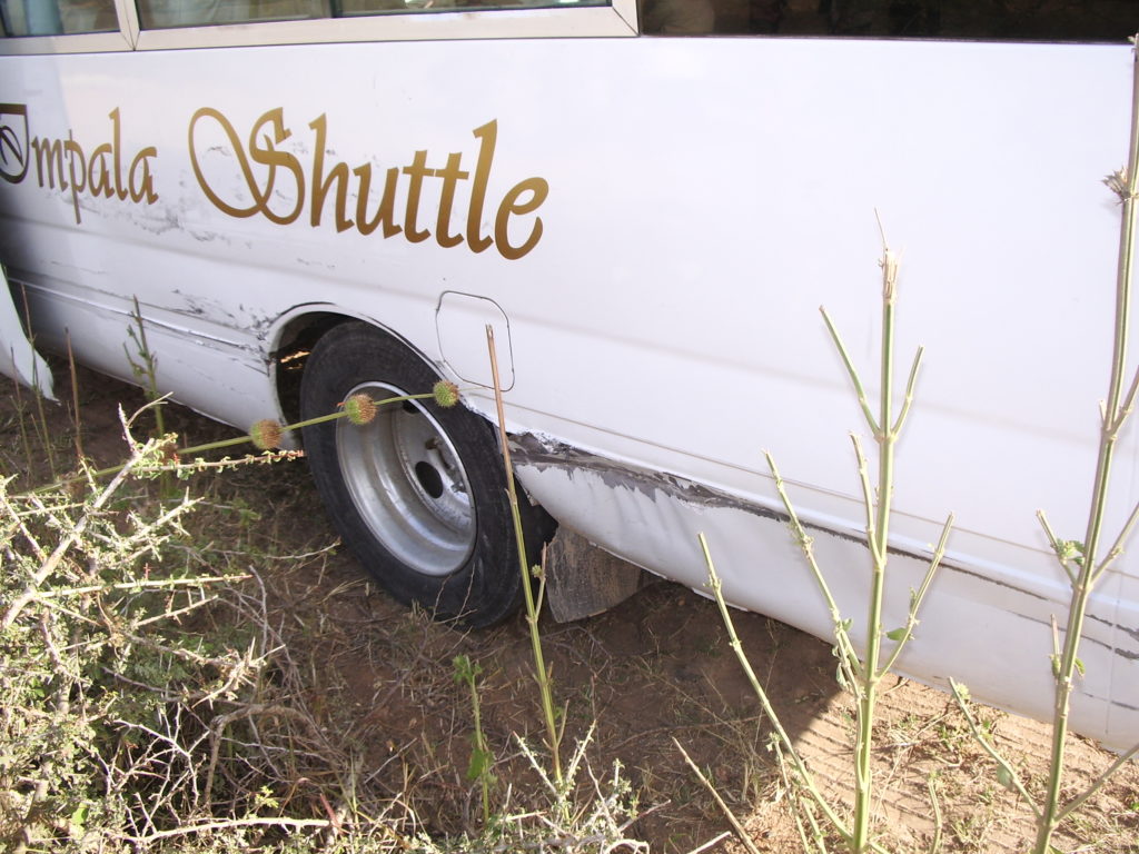 Damage to the bus after the driver pried the sheet metal away from the tire