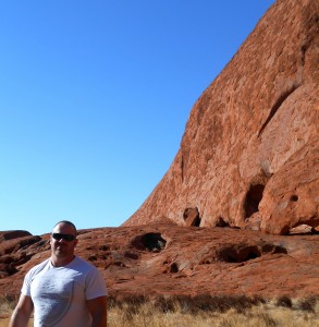 In front of Uluru, the largest rock in the world.