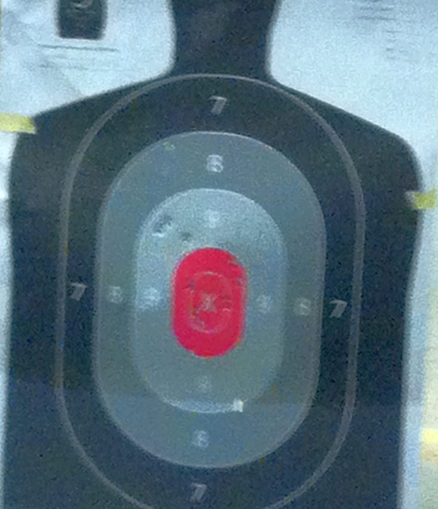 My new student's first magazine at 10 feet. It's a fuzzy cell phone pic under crappy indoor range lighting, but I think she did pretty well!