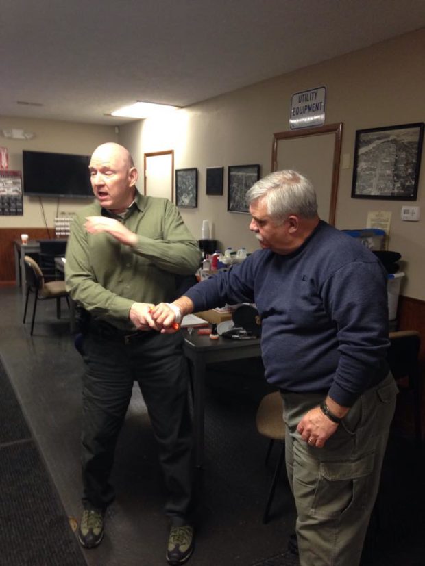 Michael de bethencourt teaching how to counter a cylinder grab. From Handgun Comatives Facebook Page.