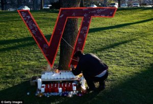 00628AD6000004B0-0-Virginia_Tech_students_write_on_a_memorial_constructed_on_the_Vi-m-2_1435860150002