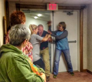 Students in my knife class Saturday. they found a proper ambush location and attacked when I (playing the role of a terrorist) made entry. One woman grabbed the gun and kept the muzzle pointed away from her and her partner. The second woman stabbed me repeatedly in the neck (with a training knife).