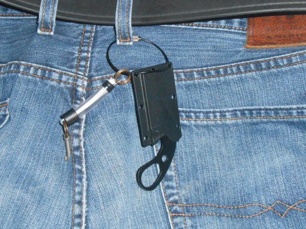 LDK knife attached to keyring and belt loop. The knife is then pushed inside the waistband of the pants and is easily missed on a casual search.