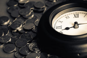 Old clock on many coins