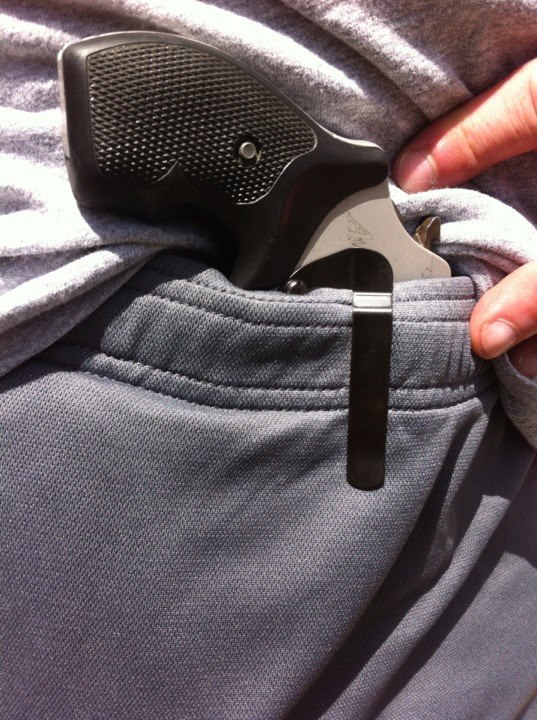 S&W 317 clipped into waistband of gym shorts