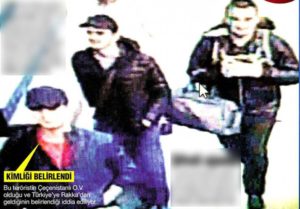 Note the terrorists' heavy coats, hiding bomb vests