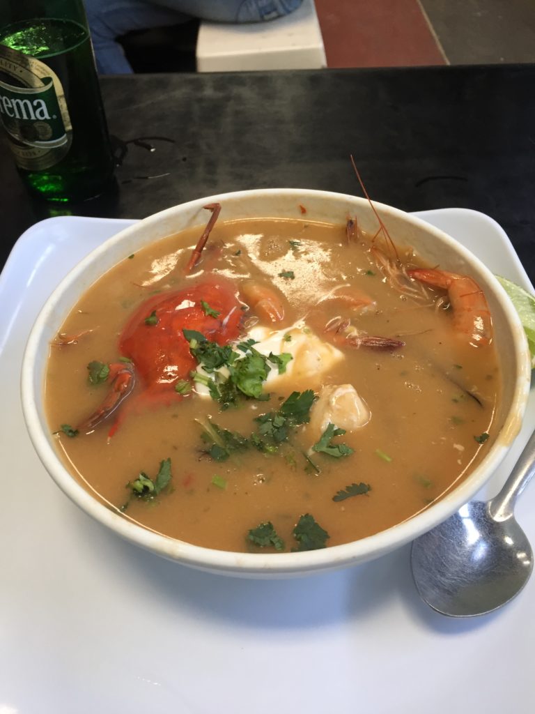 Lunch at a local market. Seafood soup. Whole crab, shrimp, clams, and about 1/2 a pound of fish. $4.00